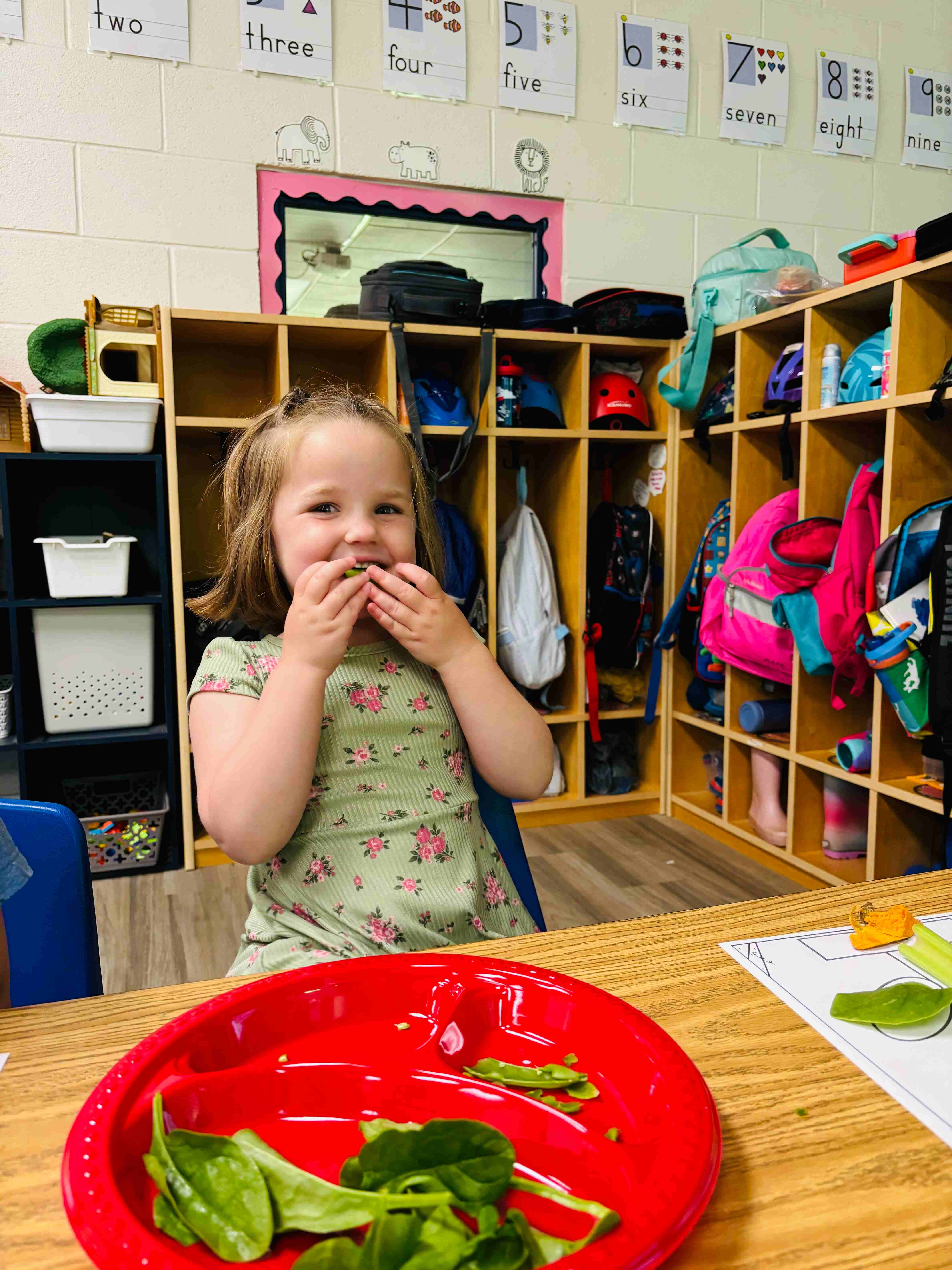 Preschool student eating a healthy snack